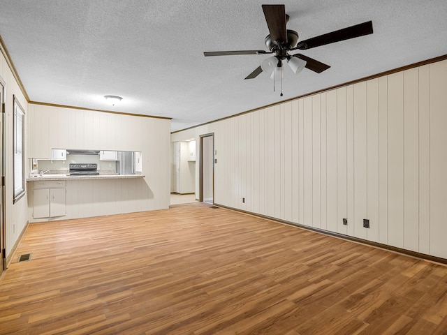 308 Pine Lake Ct, Spartanburg, SC 29301 - unfurnished living room with light wood-style flooring, ornamental molding, a textured ceiling, and ceiling fan