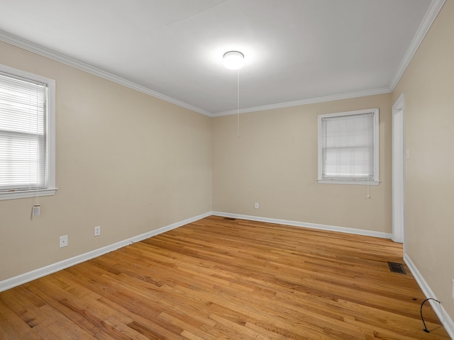 308 Pine Lake Ct, Spartanburg, SC 29301 - spare room featuring light wood-style flooring and ornamental molding
