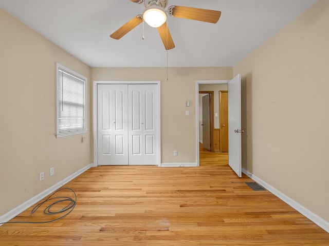 308 Pine Lake Ct, Spartanburg, SC 29301 - unfurnished bedroom with a closet, light wood-style flooring, and a ceiling fan