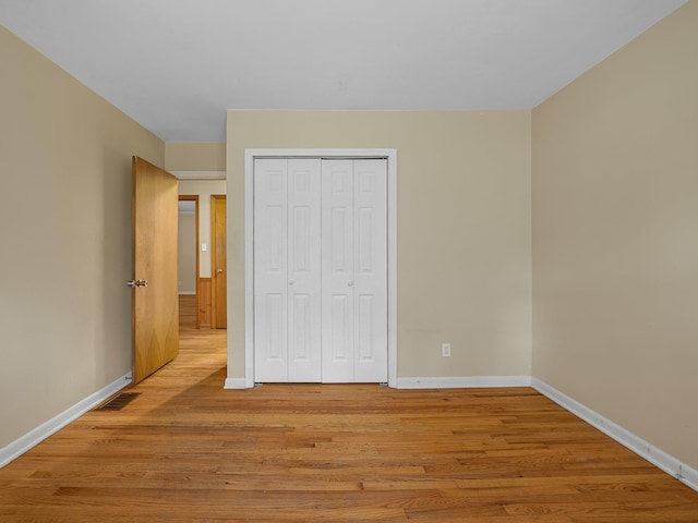 308 Pine Lake Ct, Spartanburg, SC 29301 - unfurnished bedroom featuring light wood finished floors and a closet