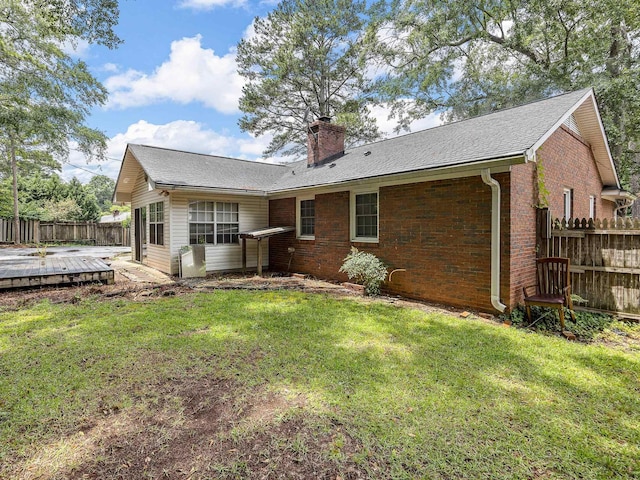 308 Pine Lake Ct, Spartanburg, SC 29301 - rear view of house with a chimney, a wooden deck, and brick siding