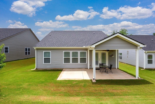 906 John Thomas Way, Greer, SC 29651 - back of property featuring ceiling fan, a yard, roof with shingles, and a patio area