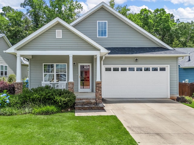 234 Page Creek Blvd, Landrum, SC 29356 - view of front of property with an attached garage, covered porch, driveway, and roof with shingles