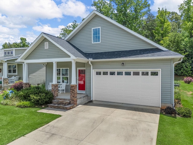 234 Page Creek Blvd, Landrum, SC 29356 - view of front of home featuring a porch, an attached garage, concrete driveway, a front lawn, and a shingled roof