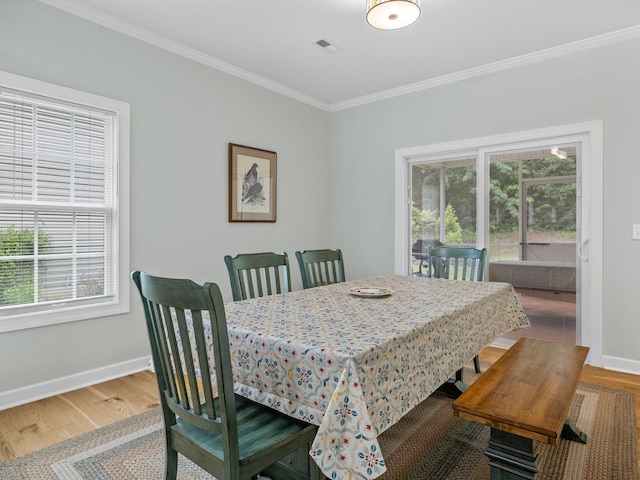 234 Page Creek Blvd, Landrum, SC 29356 - dining space featuring plenty of natural light, crown molding, and wood finished floors