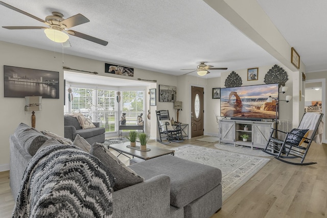 208 Kenneth Dr, Boiling Springs, SC 29316 - living area featuring a ceiling fan, wood finished floors, and a textured ceiling