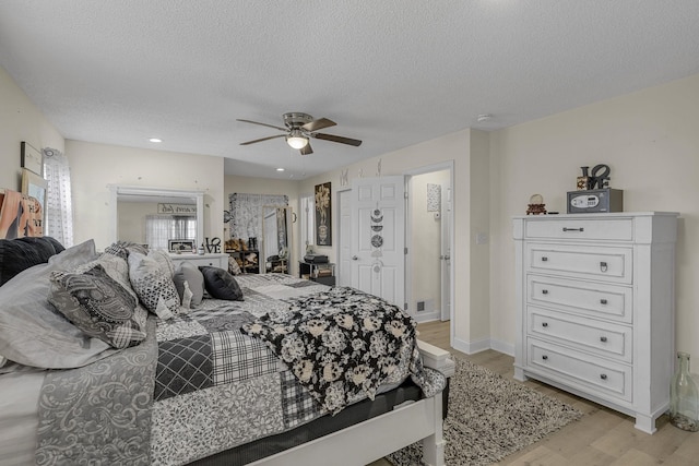 208 Kenneth Dr, Boiling Springs, SC 29316 - bedroom with light wood-style flooring, a textured ceiling, ceiling fan, and recessed lighting