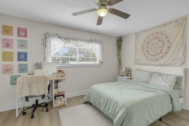 208 Kenneth Dr, Boiling Springs, SC 29316 - bedroom featuring wood finished floors, a textured ceiling, and a ceiling fan