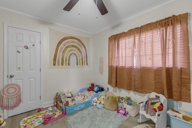 208 Kenneth Dr, Boiling Springs, SC 29316 - playroom featuring wood finished floors, a ceiling fan, crown molding, and a textured ceiling