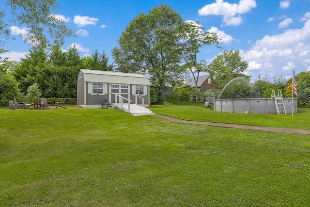 208 Kenneth Dr, Boiling Springs, SC 29316 - view of green lawn with an outdoor pool and an outdoor structure