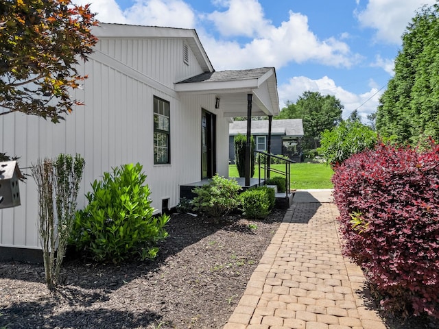116 Dodd St, Wellford, SC 29385 - view of home's exterior featuring board and batten siding and a yard