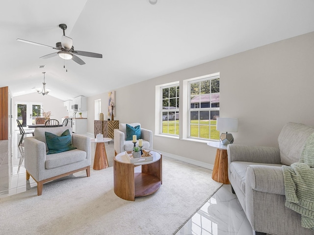 116 Dodd St, Wellford, SC 29385 - living room with plenty of natural light, lofted ceiling, a ceiling fan, light marble finish flooring, and a chandelier