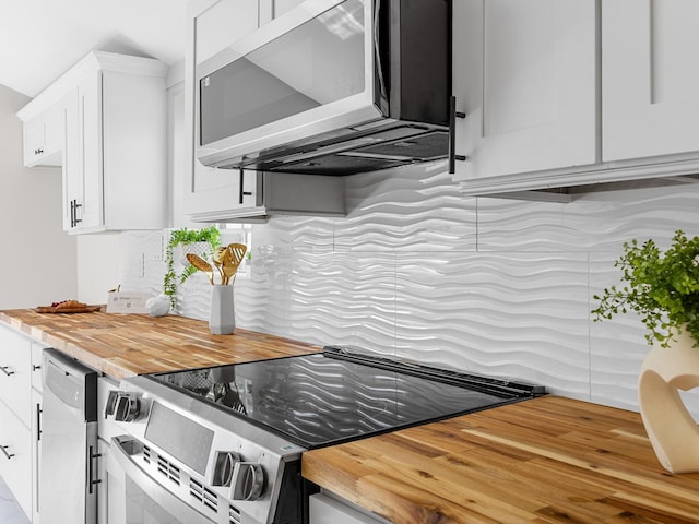 116 Dodd St, Wellford, SC 29385 - kitchen with stainless steel appliances, white cabinetry, tasteful backsplash, and butcher block counters