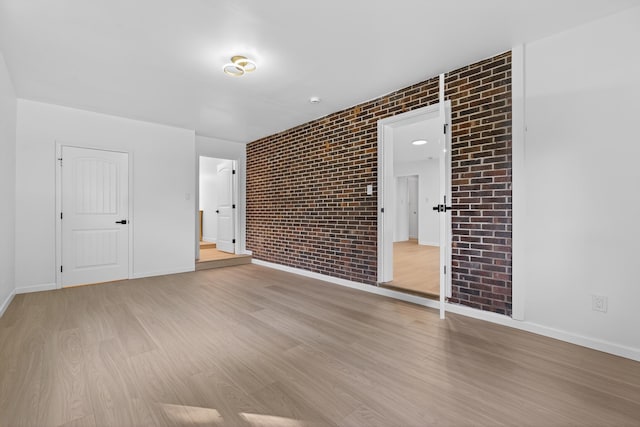 177 Lincoln Dr, Spartanburg, SC 29306 - unfurnished room featuring brick wall and light wood finished floors