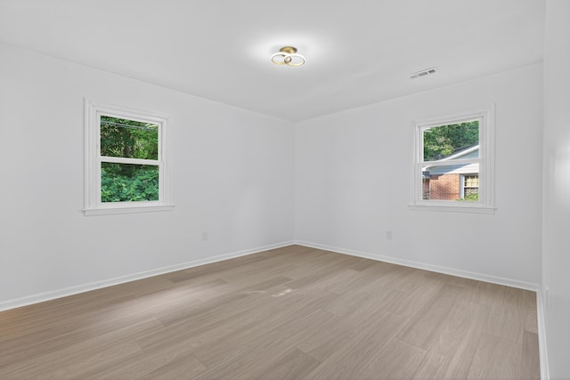 177 Lincoln Dr, Spartanburg, SC 29306 - empty room with healthy amount of natural light and light wood-style floors