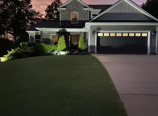 31 Goodwin Farms Ct, Travelers Rest, SC 29690 - craftsman-style house with driveway, an attached garage, stone siding, and a front yard