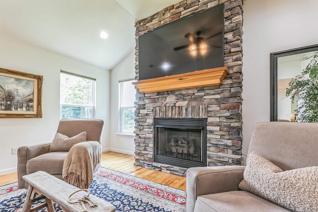 31 Goodwin Farms Ct, Travelers Rest, SC 29690 - living area with vaulted ceiling, wood finished floors, and a stone fireplace