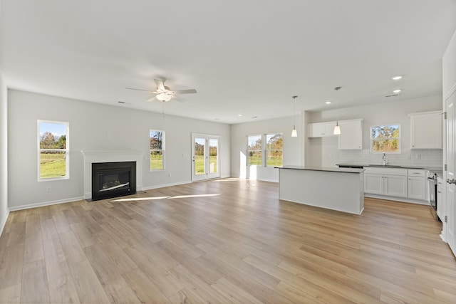 1465 Macedonia Rd, Gaffney, SC 29341 - unfurnished living room with ceiling fan, light wood finished floors, a fireplace with flush hearth, and recessed lighting