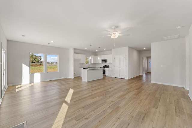 1465 Macedonia Rd, Gaffney, SC 29341 - unfurnished living room featuring a ceiling fan, recessed lighting, and light wood-style floors
