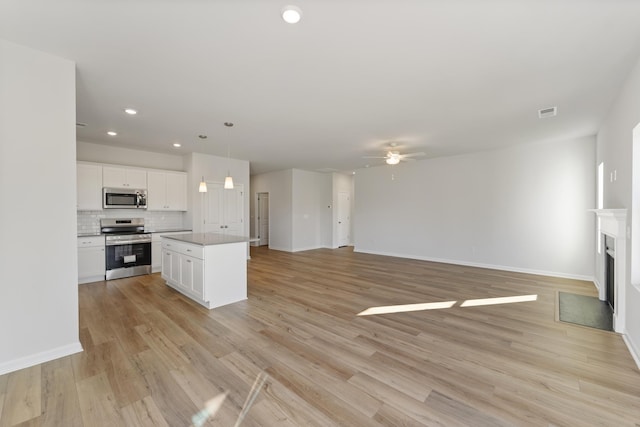 1465 Macedonia Rd, Gaffney, SC 29341 - unfurnished living room featuring ceiling fan, recessed lighting, light wood finished floors, and a fireplace