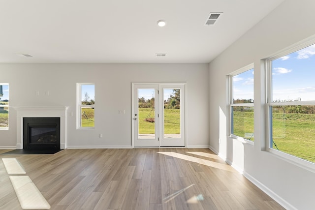 1465 Macedonia Rd, Gaffney, SC 29341 - unfurnished living room with light wood-style flooring, a fireplace with flush hearth, and recessed lighting