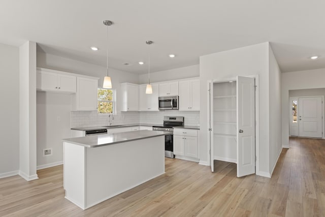 1465 Macedonia Rd, Gaffney, SC 29341 - kitchen with stainless steel appliances, tasteful backsplash, white cabinetry, and recessed lighting