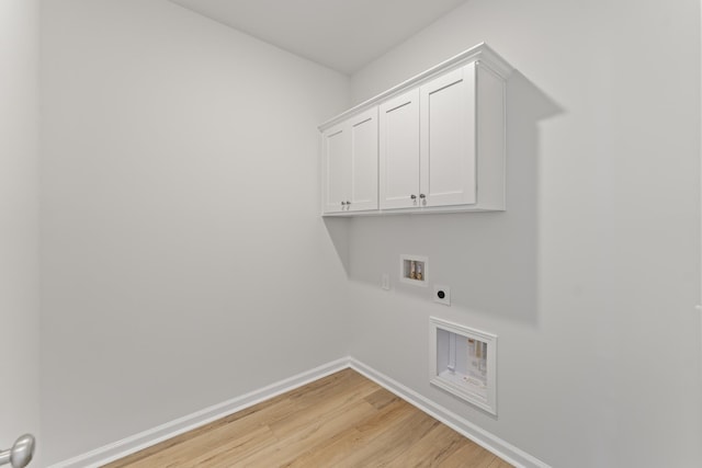 1465 Macedonia Rd, Gaffney, SC 29341 - laundry room with hookup for an electric dryer, light wood-style flooring, hookup for a washing machine, and cabinet space