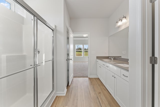 1465 Macedonia Rd, Gaffney, SC 29341 - full bathroom featuring double vanity, wood finished floors, and a shower stall