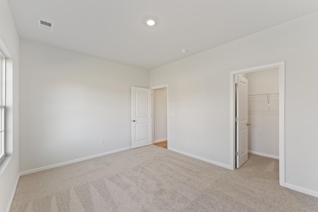 1465 Macedonia Rd, Gaffney, SC 29341 - unfurnished bedroom featuring carpet flooring, a spacious closet, and a closet