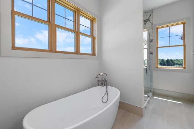 621 Bascule Ridge Ln, Campobello, SC 29322 - full bath with a soaking tub, a shower stall, and tile patterned floors