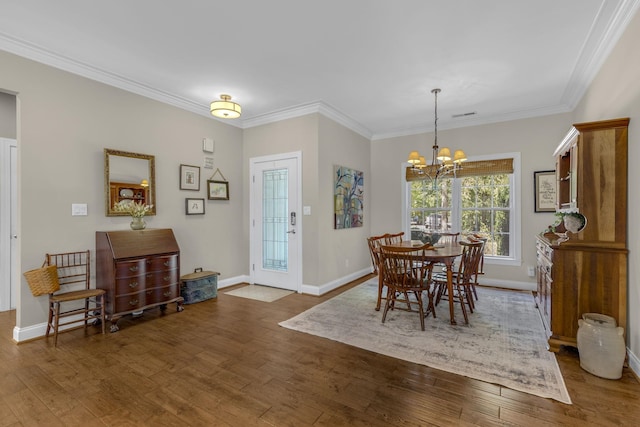 346 Bub Dr, Chesnee, SC 29323 - dining space featuring wood finished floors, ornamental molding, and a chandelier
