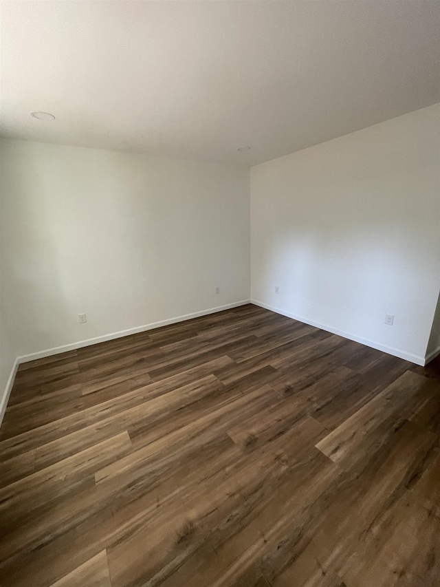 631 S Center St, Spartanburg, SC 29301 - empty room featuring dark wood-style floors and baseboards