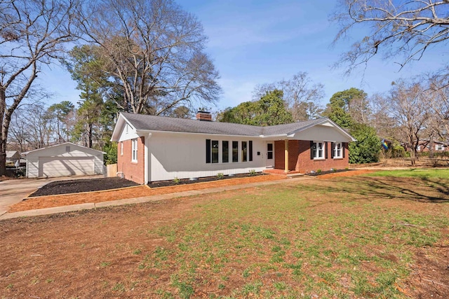 306 Fernwood Dr, Spartanburg, SC 29307 - ranch-style house featuring brick siding, a chimney, an outbuilding, a front yard, and a detached garage