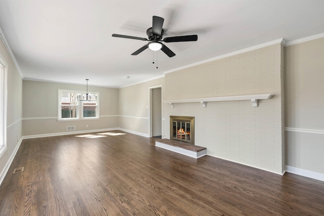 306 Fernwood Dr, Spartanburg, SC 29307 - unfurnished living room with a brick fireplace, a chandelier, dark wood-style flooring, a ceiling fan, and crown molding