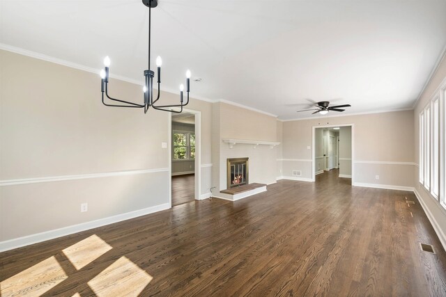 306 Fernwood Dr, Spartanburg, SC 29307 - unfurnished living room featuring a chandelier, ceiling fan, dark wood-style floors, ornamental molding, and a fireplace