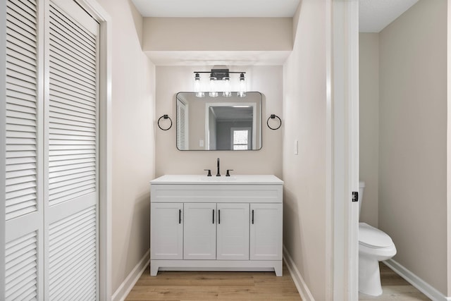 306 Fernwood Dr, Spartanburg, SC 29307 - bathroom with a closet, vanity, and wood finished floors
