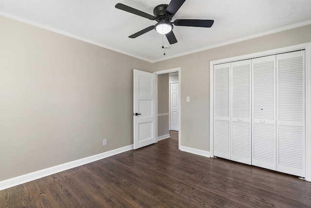 306 Fernwood Dr, Spartanburg, SC 29307 - unfurnished bedroom with dark wood finished floors, ornamental molding, a closet, and a ceiling fan