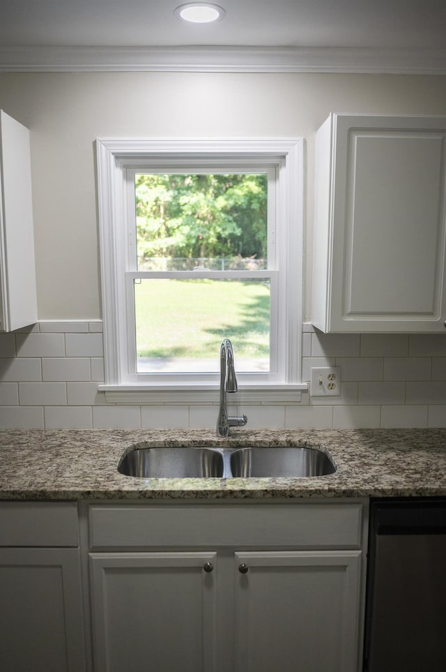 201 Bent Creek Dr, Greer, SC 29650 - kitchen with ornamental molding, backsplash, healthy amount of natural light, light stone counters, and white cabinets