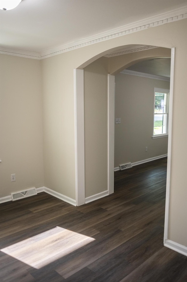 201 Bent Creek Dr, Greer, SC 29650 - empty room featuring arched walkways, wood finished floors, and crown molding