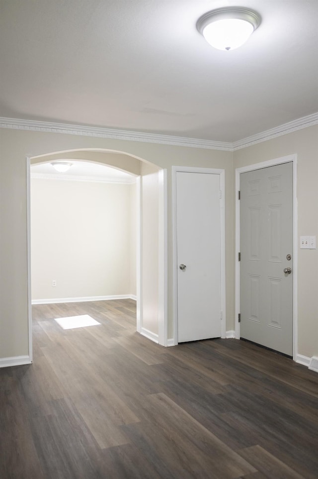 201 Bent Creek Dr, Greer, SC 29650 - entrance foyer with arched walkways, ornamental molding, and dark wood-style flooring