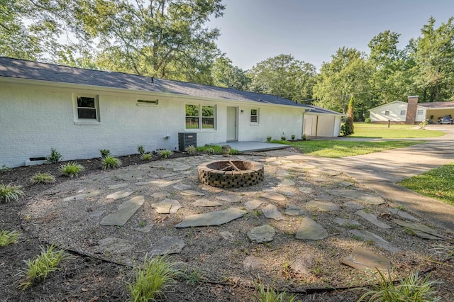 201 Bent Creek Dr, Greer, SC 29650 - rear view of house featuring an outdoor fire pit, a patio, brick siding, a lawn, and crawl space