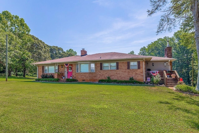 849 Harvey Rd, Greer, SC 29651 - ranch-style house with a chimney, a front yard, and brick siding