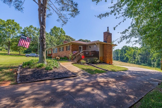 849 Harvey Rd, Greer, SC 29651 - ranch-style home with a chimney, brick siding, and a front lawn