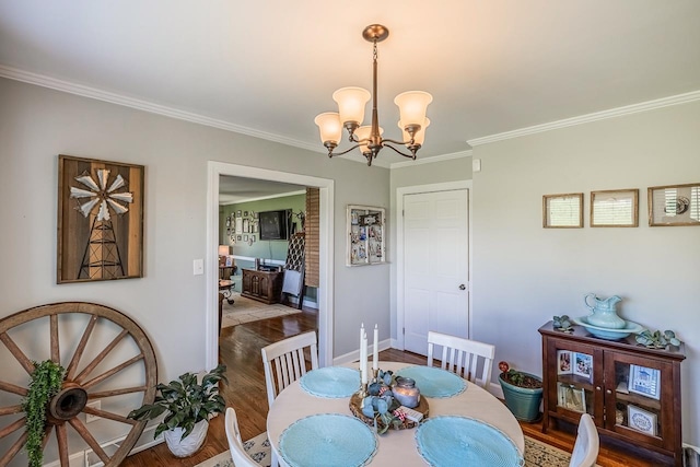849 Harvey Rd, Greer, SC 29651 - dining room featuring wood finished floors, ornamental molding, and a chandelier
