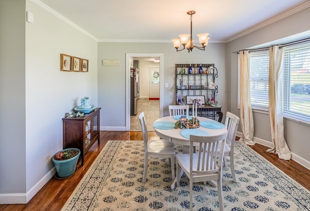 849 Harvey Rd, Greer, SC 29651 - dining area featuring crown molding, a chandelier, and wood finished floors