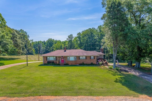 849 Harvey Rd, Greer, SC 29651 - single story home with a chimney, driveway, and a front lawn