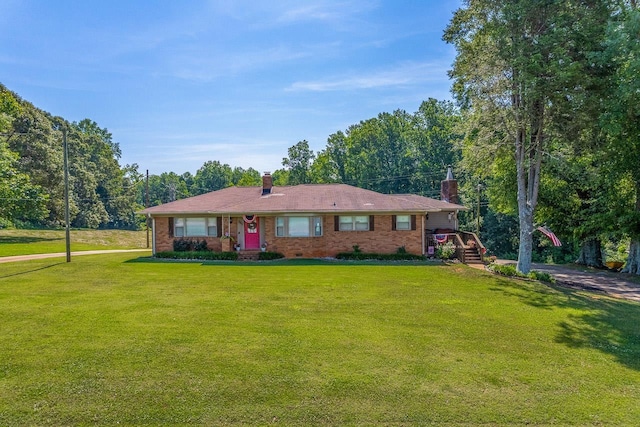 849 Harvey Rd, Greer, SC 29651 - ranch-style house featuring a chimney, a front yard, and brick siding