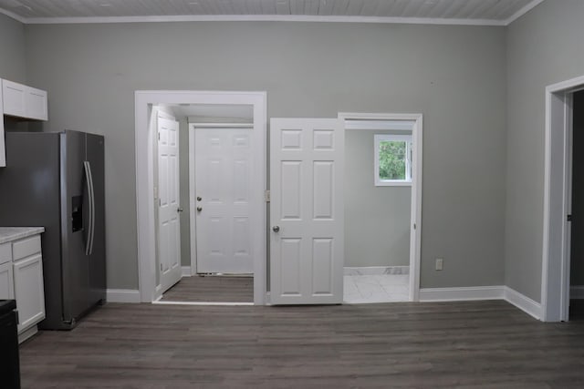 305 Spring St, Union, SC 29379 - kitchen featuring stainless steel refrigerator with ice dispenser, ornamental molding, white cabinetry, dark wood-style floors, and light countertops