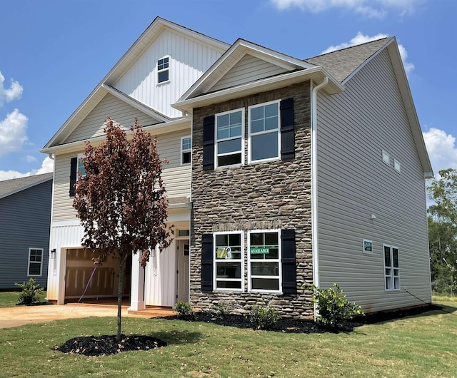 135 Hunter Ridge Dr, Boiling Springs, SC 29316 - view of front of home featuring stone siding, a garage, concrete driveway, and a front yard