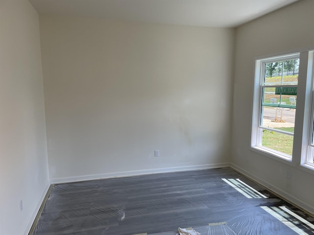 135 Hunter Ridge Dr, Boiling Springs, SC 29316 - empty room with plenty of natural light and dark wood finished floors